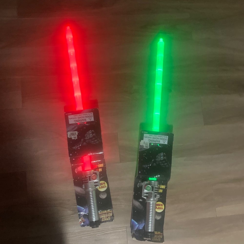 Light-Up Toy Swords with Sound Effects green and red light